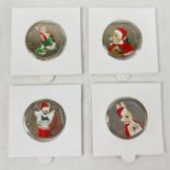 A set of 4 2018 Beatrix Potter 50p coins with coloured Christmas decals. In sealed card & clear