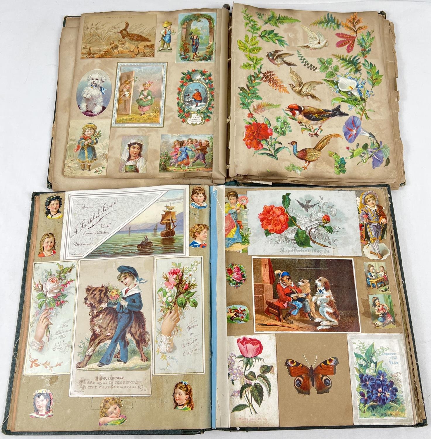 2 early 20th century green coloured scraps albums containing a quantity of assorted scraps and