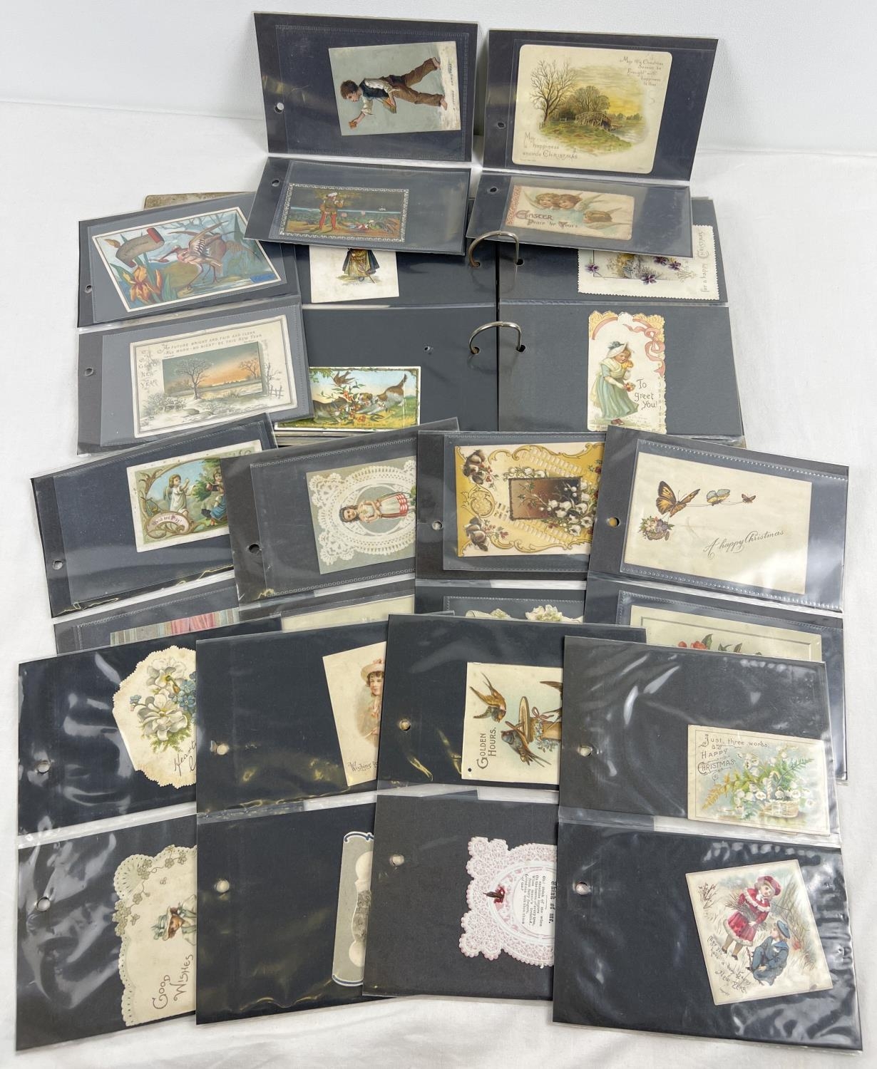 A small album containing 113 assorted Victorian & Edwardian greetings cards. To include Christmas,