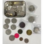 A small tin of vintage British and foreign coins and tokens. To include 3 sets of half crown, two