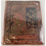 A Victorian large red scraps album with cover decorated in an Oriental design with gilt detail.