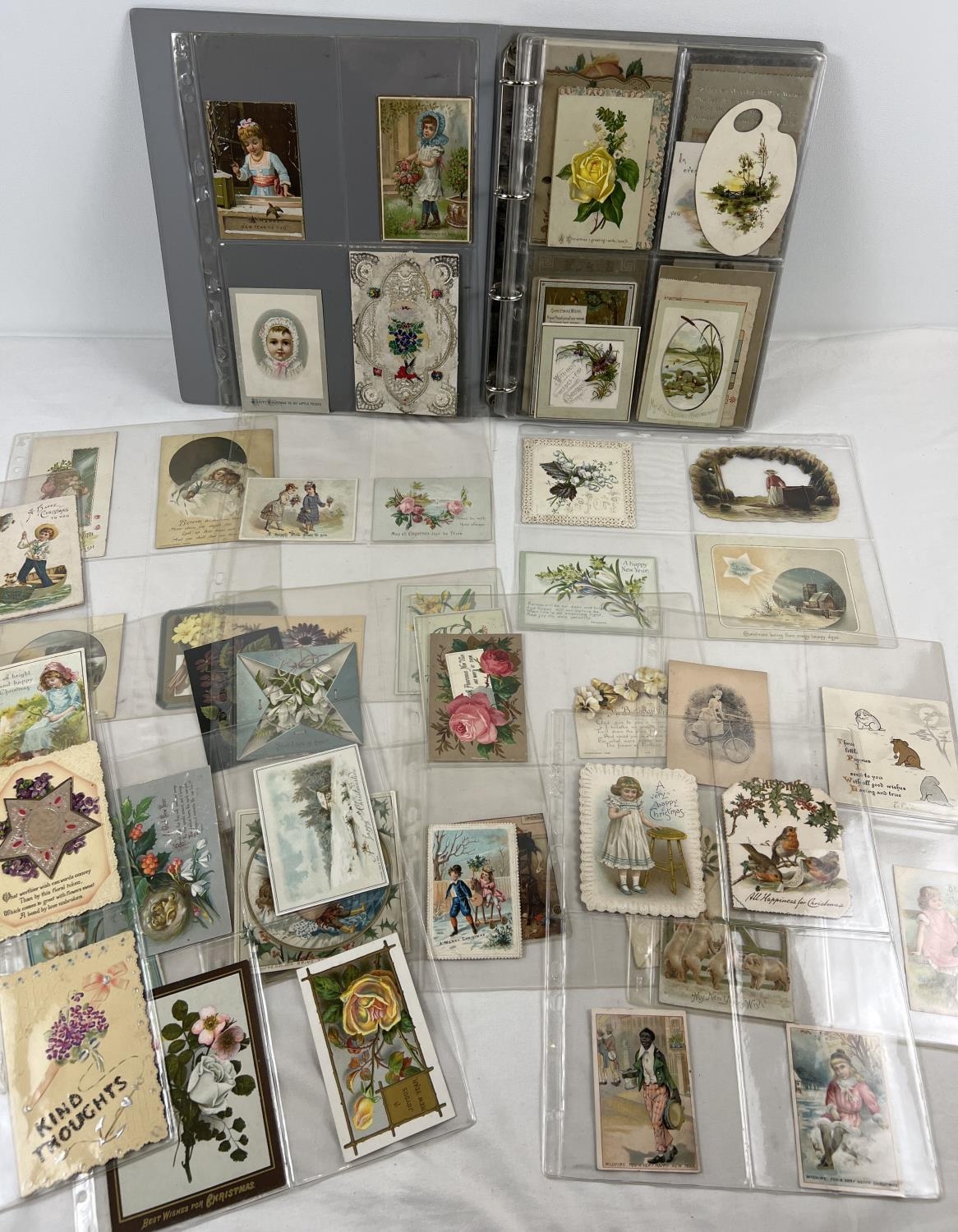 An album containing 88 assorted Victorian & Edwardian greetings cards. In varying styles, sizes