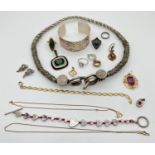 A small collection of costume jewellery. To include a large ethnic design torque style necklace, a