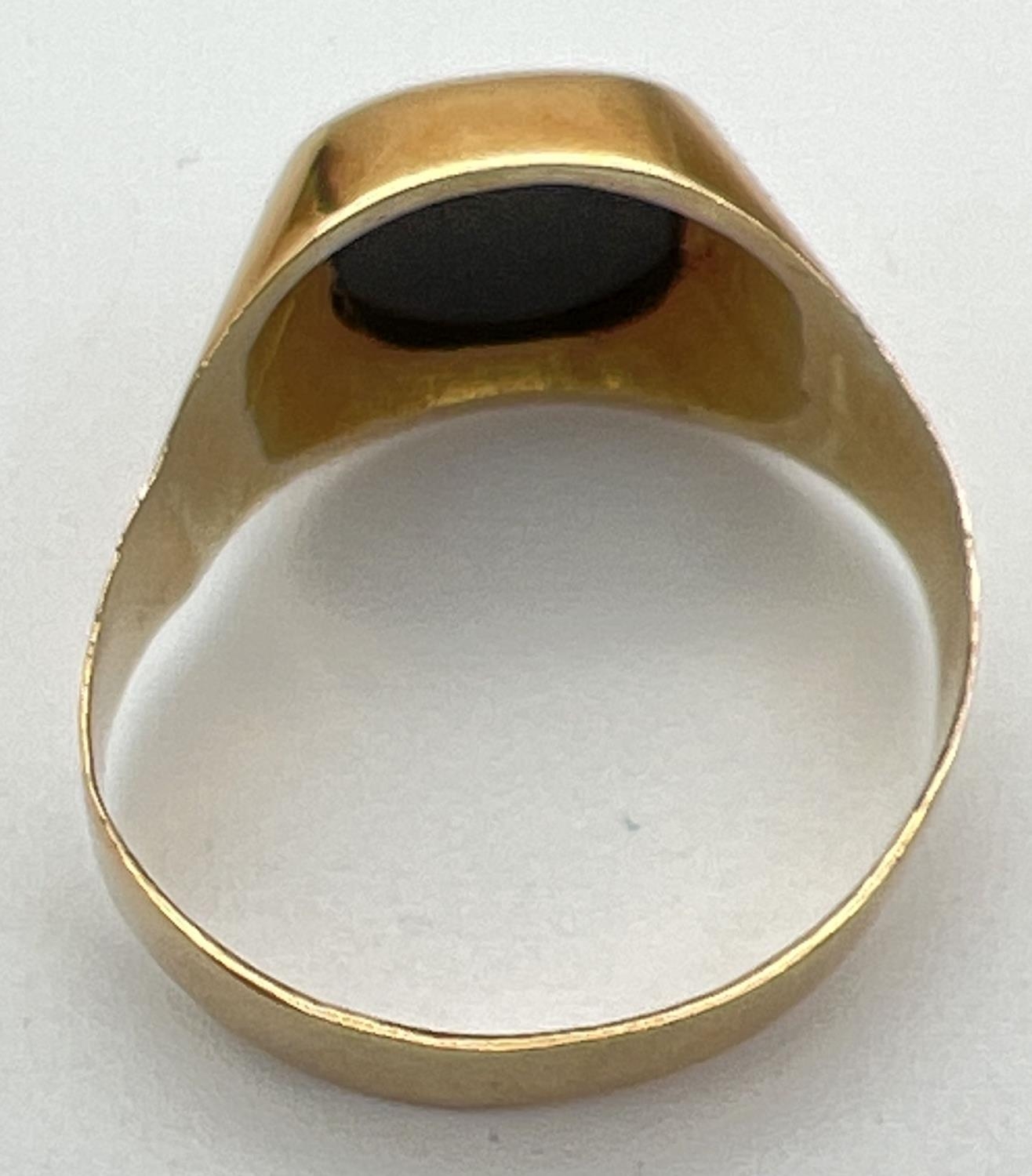 A men's 20ct gold and black onyx signet ring, band slightly misshapen. Stamped 83.5 inside band. - Image 2 of 4