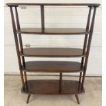 A vintage 1960's Ercol dark wood room divider with 5 curved edge shelves. Raised on 4 small