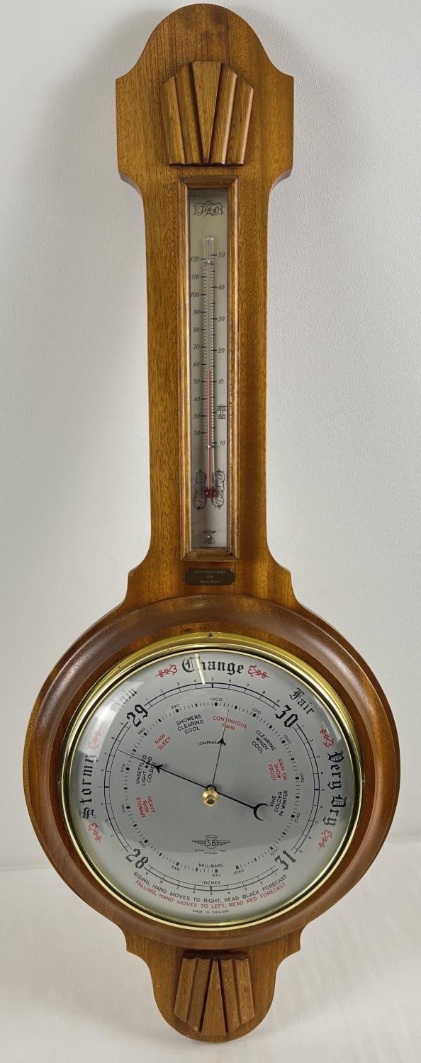 A vintage wooden cased barometer by Shortland with small brass inscribed plaque " West Street Hunt