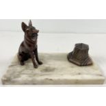 An Art Deco design marble based standish desk stand with spelter dog figure and stylised inkwell