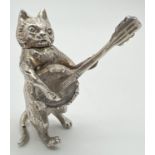 An Edwardian silver novelty container modelled as a cat playing a banjo, with hinged head. Import