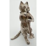 An Edwardian silver novelty container modelled as a cat playing the clarinet, with hinged head.