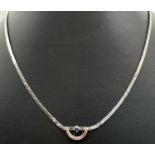 A 925 silver 15" fixed pendant necklace with flat triangular shaped links. Pendant set with