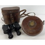 A vintage pair of Kallos Colmont, Paris binoculars together with a Chesterman tape measure. Both