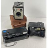 3 vintage cased cameras. A Kodak Brownie Flash III boc camera, in brown canvas case, together with 2