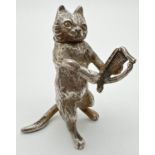 An Edwardian silver novelty container modelled as a cat playing a lyre/harp, with hinged head.