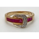 A 9ct gold ruby and diamond set buckle style dress ring. Band channel set with 5 square cut