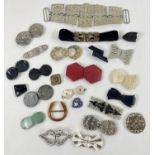 A collection of antique and vintage dress clips in various sizes and design. To include Art Deco