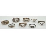 8 silver and white metal rings, mostly band style. To include Mizpah, wishbone and heart shaped