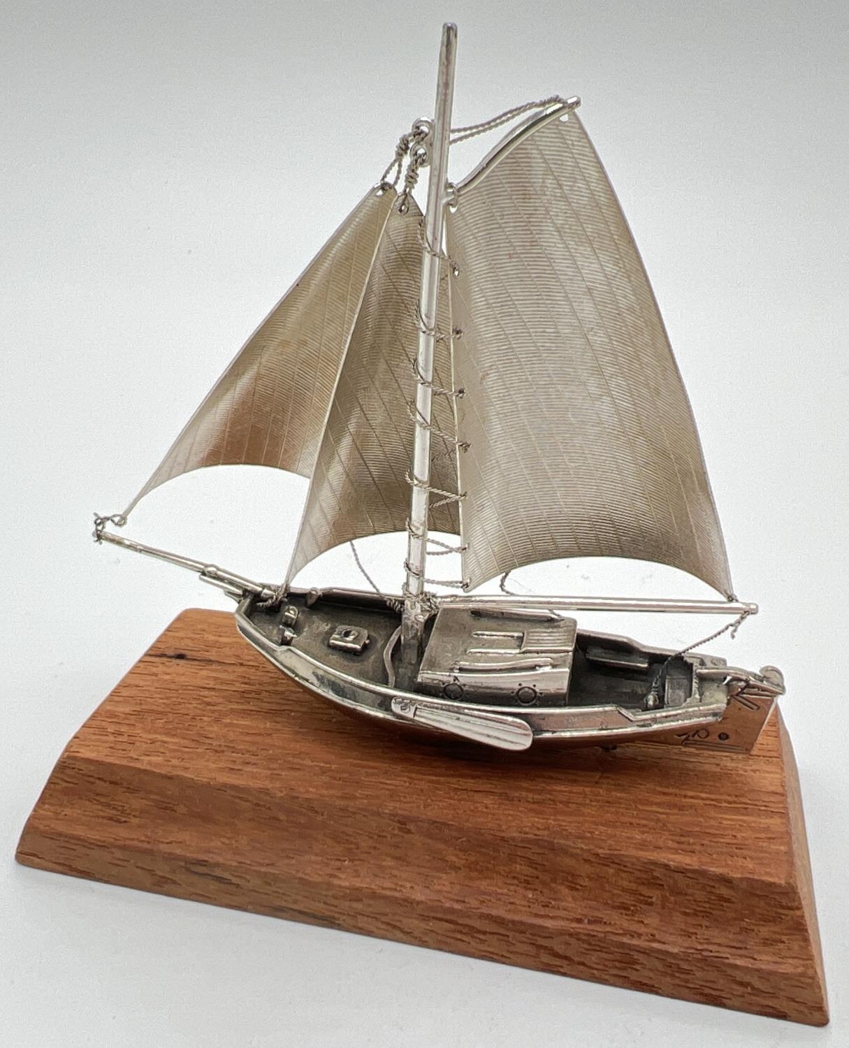 A vintage silver model of a sailing boat mounted on a wooden plinth. Very well detailed with matte - Image 3 of 4