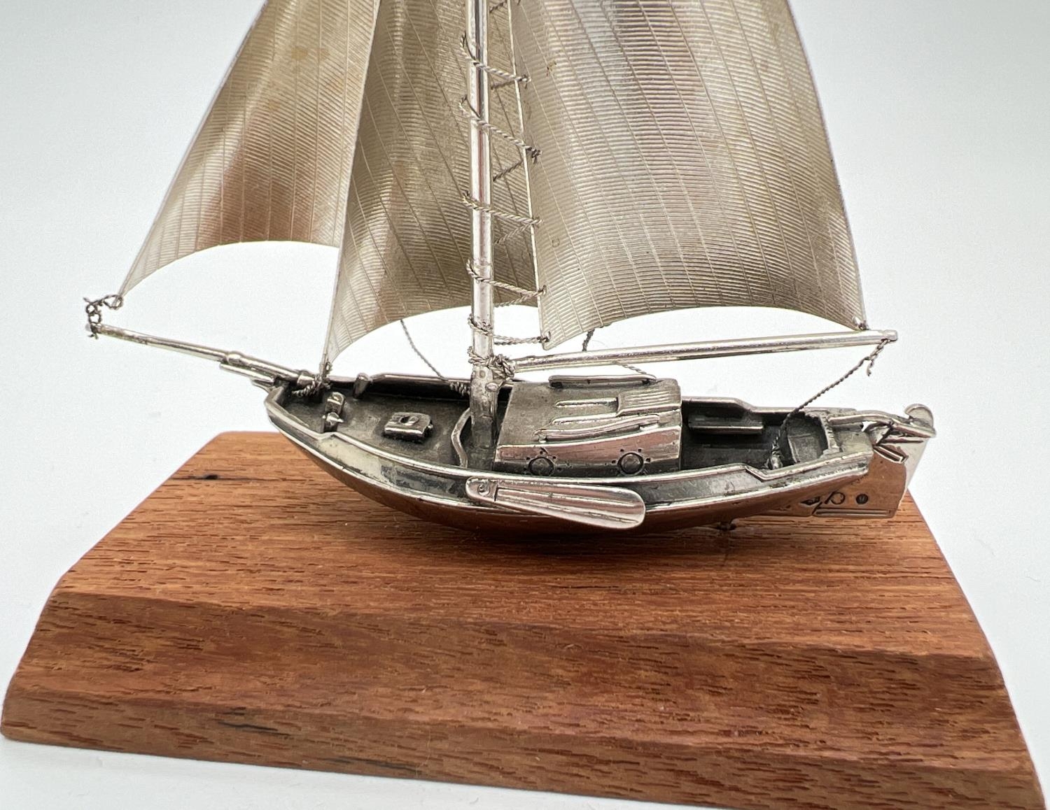 A vintage silver model of a sailing boat mounted on a wooden plinth. Very well detailed with matte - Image 4 of 4