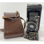 An antique Kodak 3A Autographic Special Model B bellows camera, with original brown leather case.