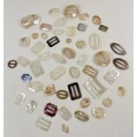 A collection of 50 antique and vintage mother of pearl buckles in various sizes and designs. To
