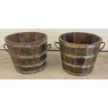2 vintage wooden half barrel planters with brass banding and handles. Approx. 44cm diameter x 35.5cm