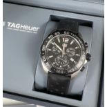 A boxed TAGHeuer Caz 1010 WME7172 Mens tachymeter chronograph wristwatch with black silicone