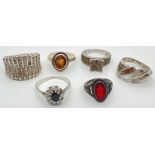 6 silver dress rings, all stone set. In varying sizes and conditions. To include sapphire, garnet