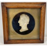 An antique framed and glazed plaster bust of The Duke of Wellington. Frame size approx. 24 x 23cm.