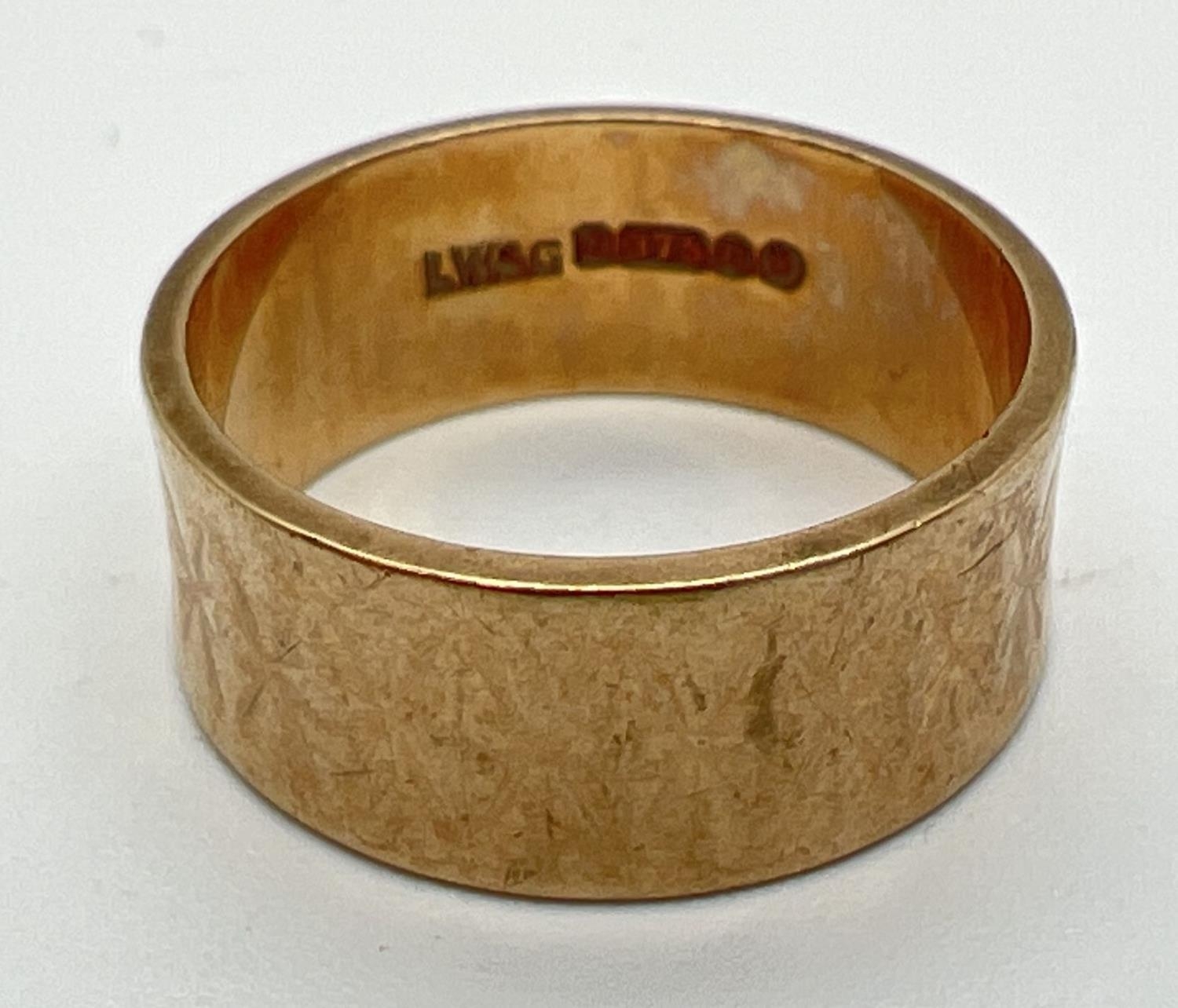 A 9ct gold vintage style 7mm wedding band with diamond pattern. Full hallmarks to inside of band