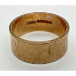 A 9ct gold vintage style 7mm wedding band with diamond pattern. Full hallmarks to inside of band