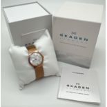 A boxed ladies Skagen 233XSRR wristwatch. Gold tone mesh bracelet strap and case with mother of