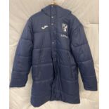 A Norwich City Football Club, NCFC, Joma staff padded coat with team crest and Lotus logo to