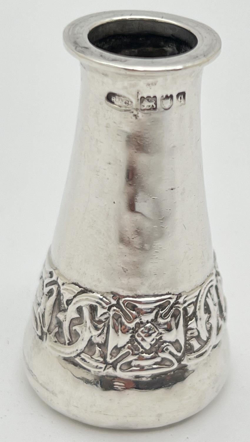 An Arts & Crafts small silver bud vase with stylised banded design to lower body. Fully hallmarked