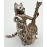 An Edwardian silver novelty container modelled as a cat playing a cello, with hinged head. Import