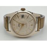 A vintage Smiths Empire shockproof 5 jewels mechanical wristwatch. With engine turned face, gold