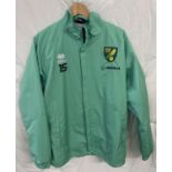 A pale green NCFC Norwich City Football club training jacket, by Errea. Complete with embroidered