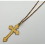 A vintage 9ct gold cross pendant on an 18" fine curb chain with spring clasp. Chain needs attention,