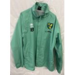 A pale green NCFC Norwich City Football club training jacket, by Errea. Complete with embroidered