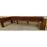 A large corner bench seat as taken from a local pub, originally made from antique pews. Covered in