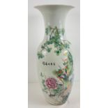 A large floor standing oriental ceramic vase with crane, exotic bird and floral decoration.