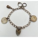 A vintage silver charm bracelet with4 charms, padlock and safety chain. Charms include wedding and