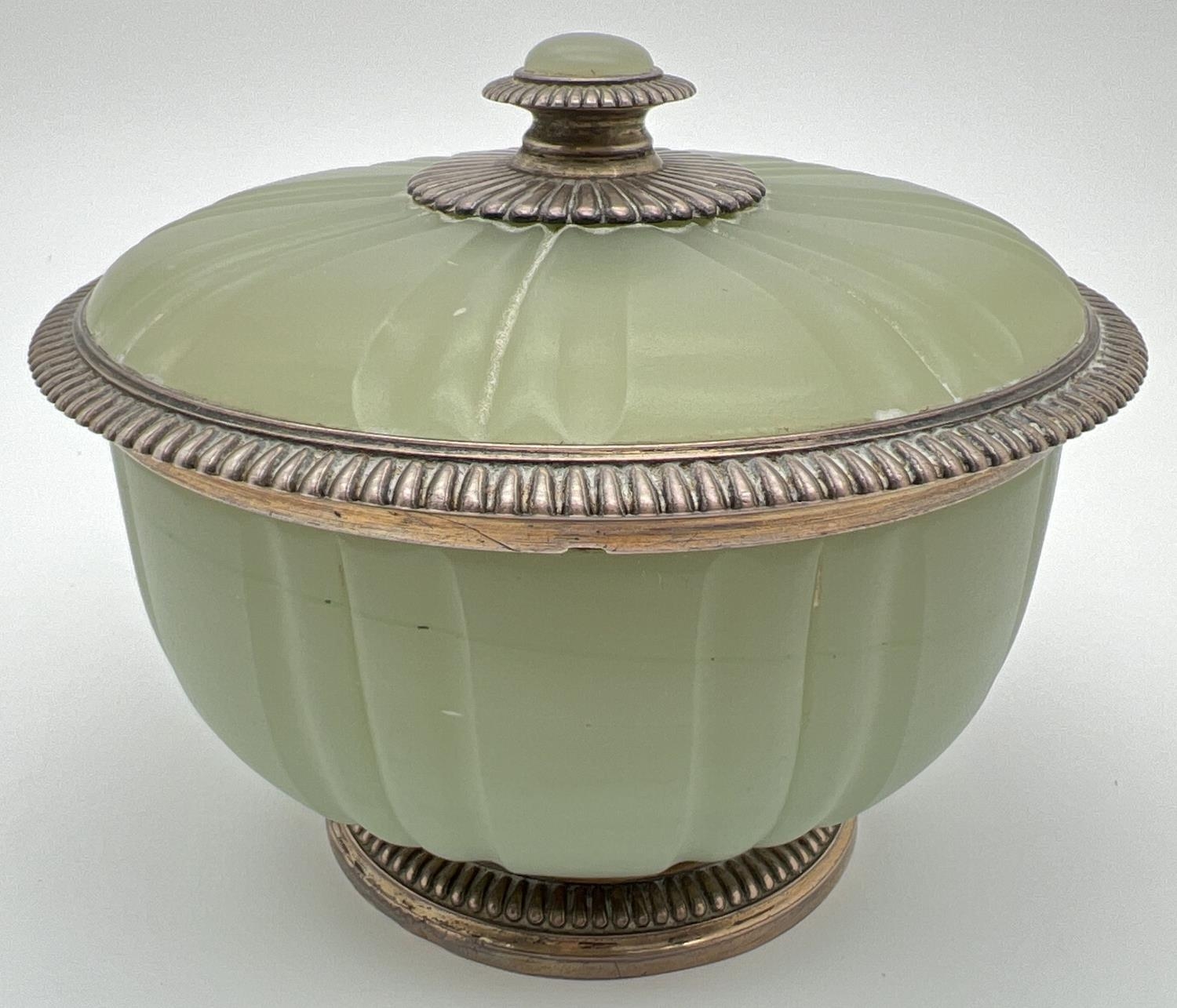 A late Victorian French green opaline glass lidded bowl with silver mount, circa 1900. Gilt to