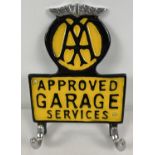 An aluminium wall hanging hook with painted AA Approved Garage Services detail. Approx. 21cm x 15cm.