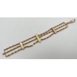 A vintage yellow gold 3 bar style bracelet with decorative chain links and rose gold lobster claw