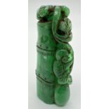 A carved piece of jade in the form of bamboo with foliate detail. Approx. 6.5cm long.