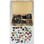 A vintage fabric covered sectional box containing a large collection of vintage buttons, to