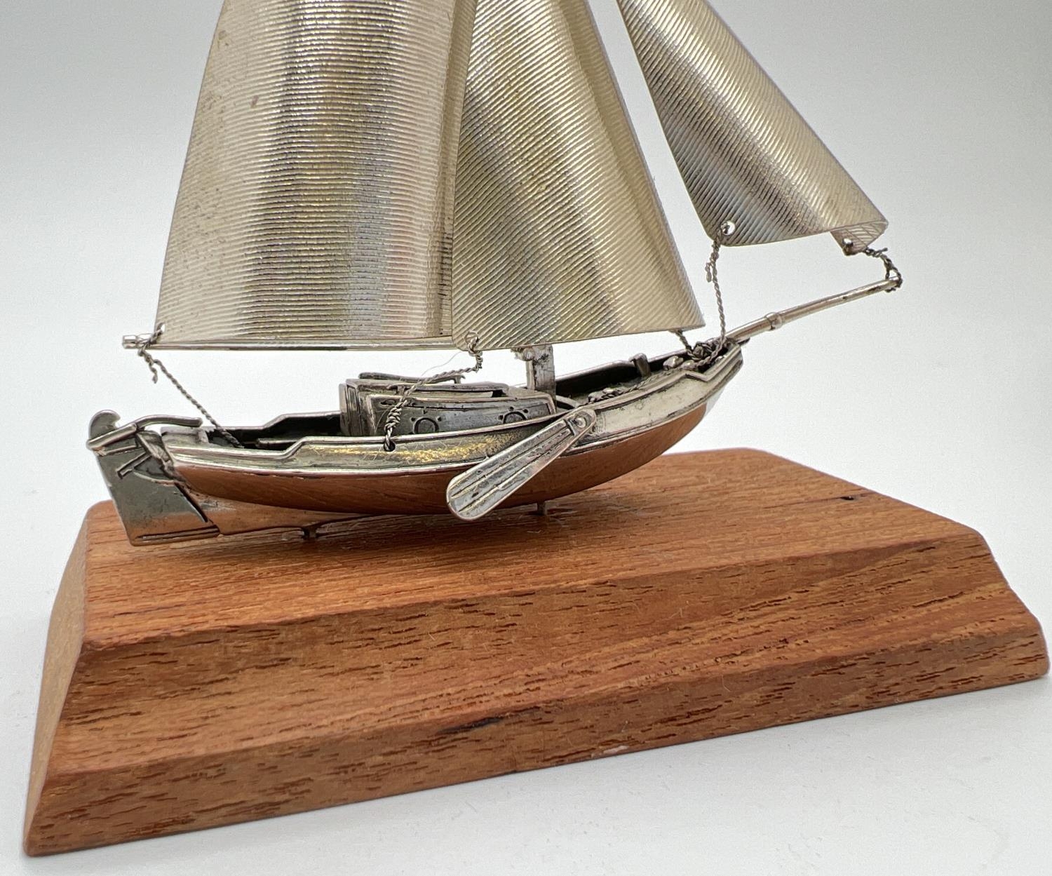 A vintage silver model of a sailing boat mounted on a wooden plinth. Very well detailed with matte - Image 2 of 4