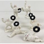 6 small painted cast metal Michelin Man figures, each holding a tyre. Tallest approx. 9cm tall.