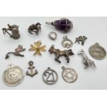 15 silver and white metal charms/pendants in varying conditions. To include beer stein, giraffe,