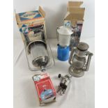 A collection of boxed and unboxed camping equipment, mostly lighting. To include a boxed single